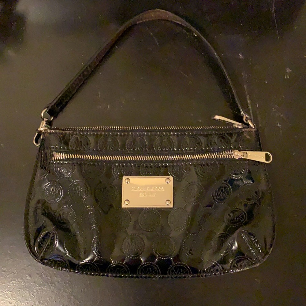 Black MK mini clutch with strap.